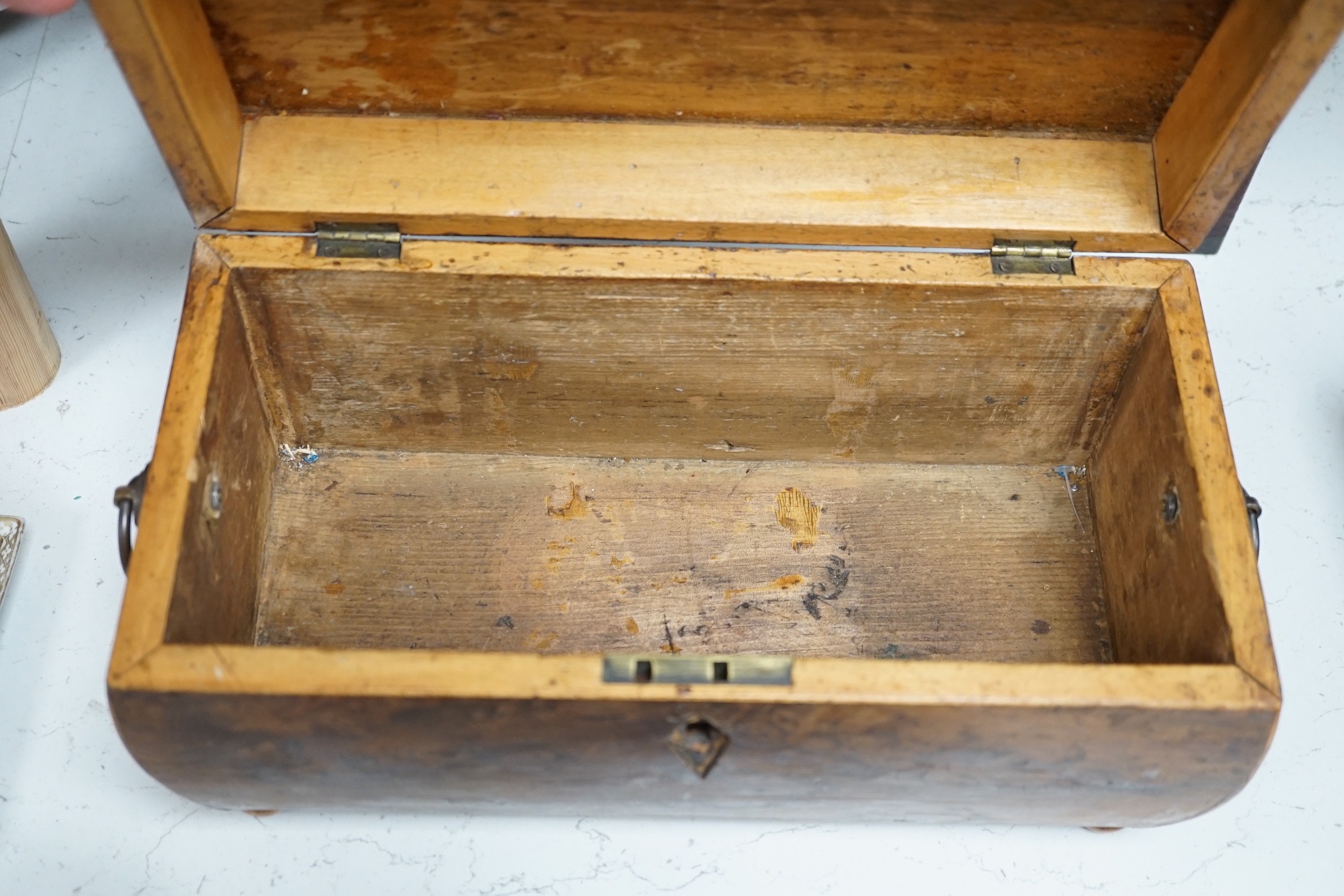 A Victorian boxwood strung burr yew sarcophagus shaped tea caddy, another mahogany tea caddy, a brass bound mahogany silver box with Bramah lock and another mahogany box. Largest 40cm wide